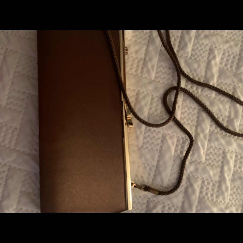 Women brown open toe heel 21/2 inches high, brown clutch bag/shoulder strap.